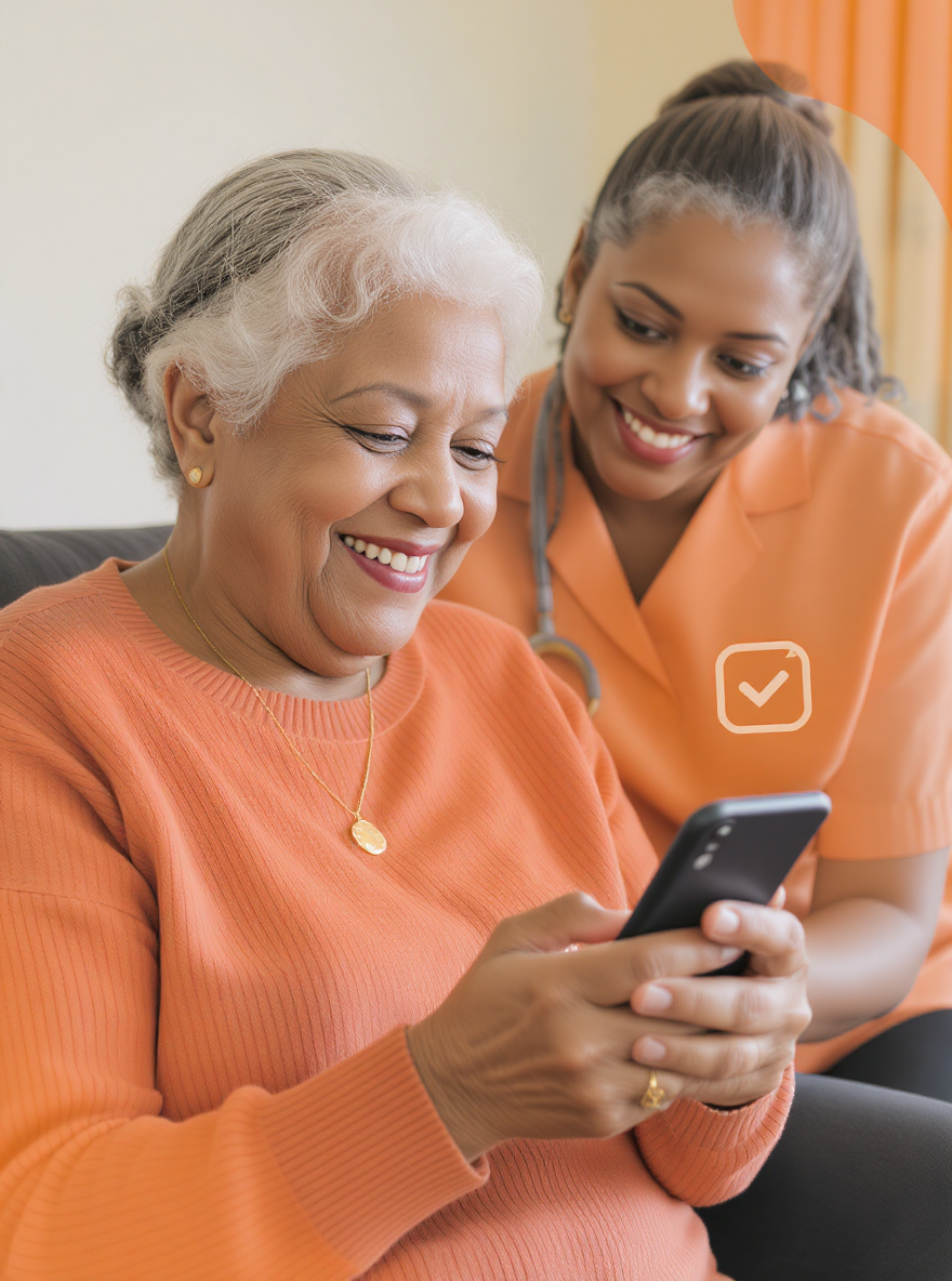 Senior woman smiling while using her phone, helped by a caregiver